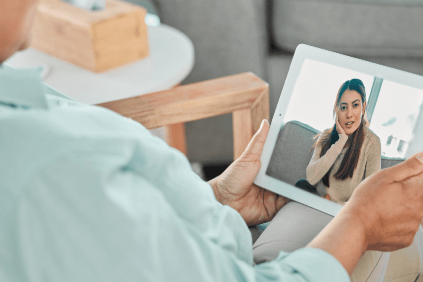 Telehealth Therapy in Utah - Woman talking with a therapist remotely.