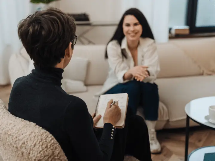 A therapist guiding a client through Cognitive Processing Therapy to reframe trauma-related thoughts.